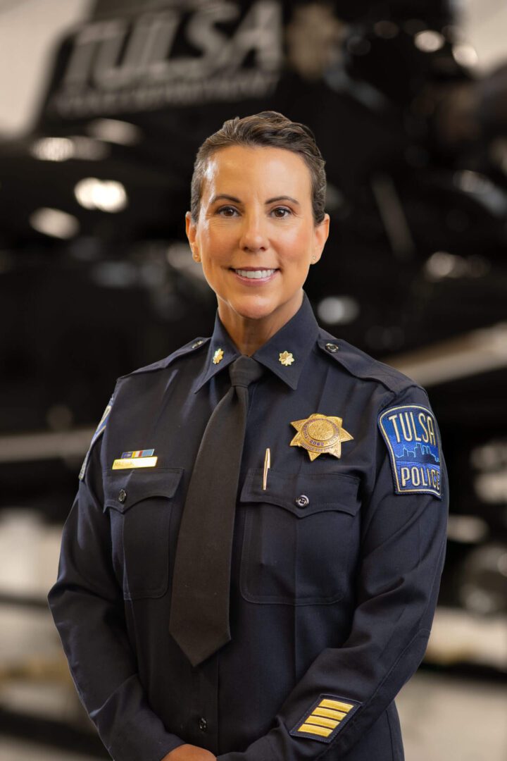 Smiling Tulsa police officer in dress uniform