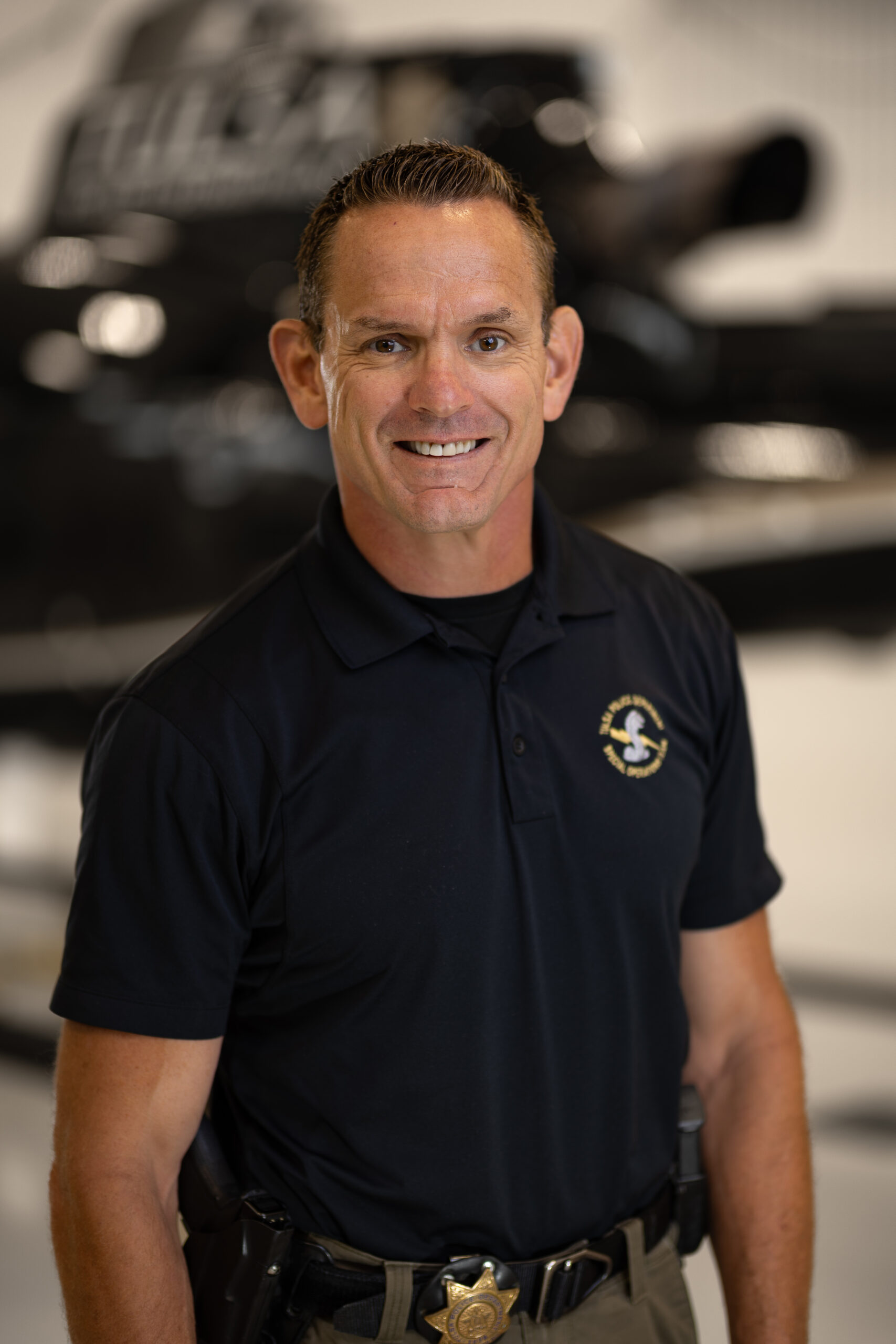 Smiling man in law enforcement uniform